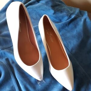 White patent pumps